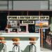 Boutique coffee shop storefront in Bangkok with modern seating and signage